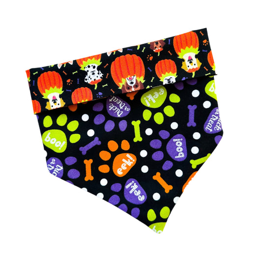 Halloween-themed dog bandana with pumpkins, ghosts, and bones on a black background.