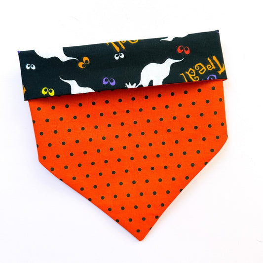 Orange polka dot bandana with black cat pattern on a white background