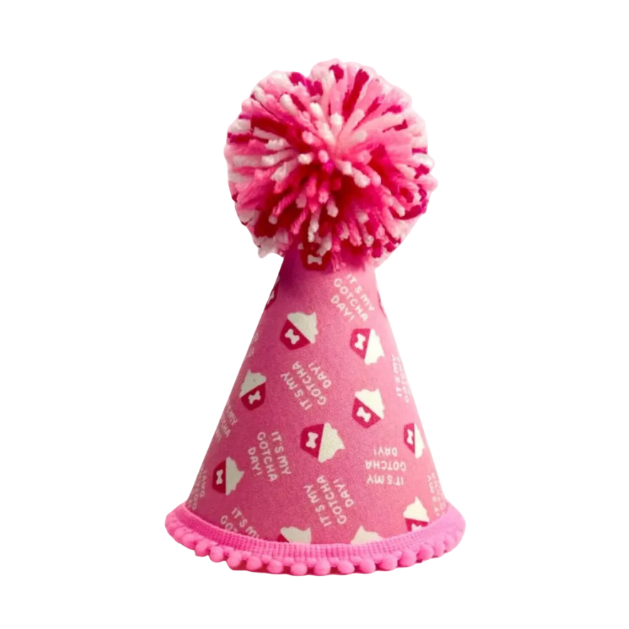 Pink party hat with a pom-pom on a white background